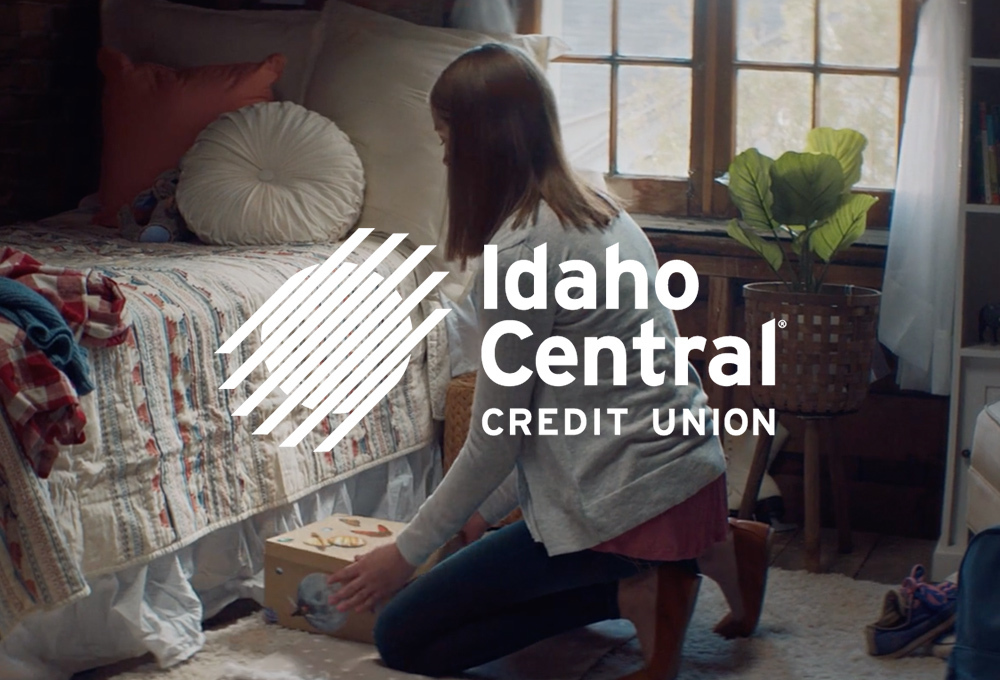 Idaho Central Credit Union logo over background of woman kneeling next to bed