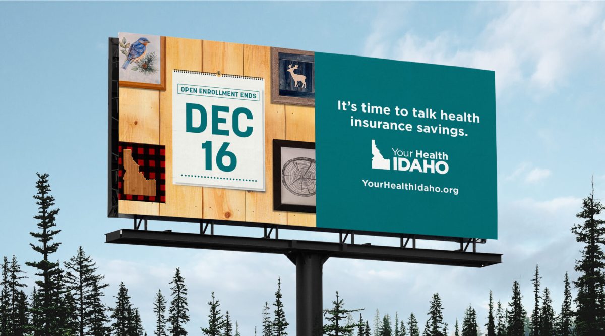 Outdoor billboard among the trees reading It's time to talk health insurance savings. Your Health Idaho.