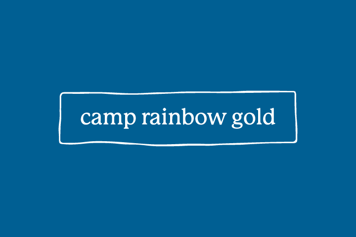 Camp Rainbow Gold logo on blue background